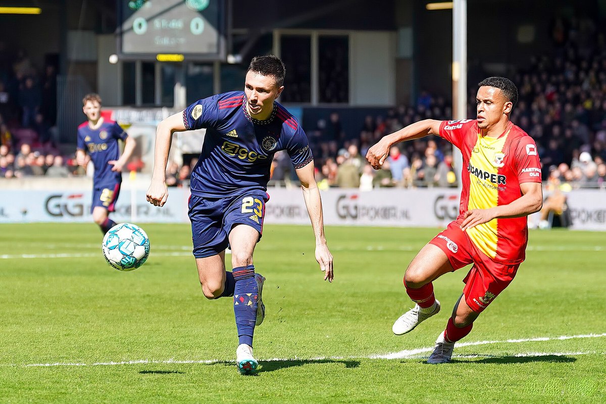 Ajax and Go Ahead Eagles players contest the ball in the Eredivisie