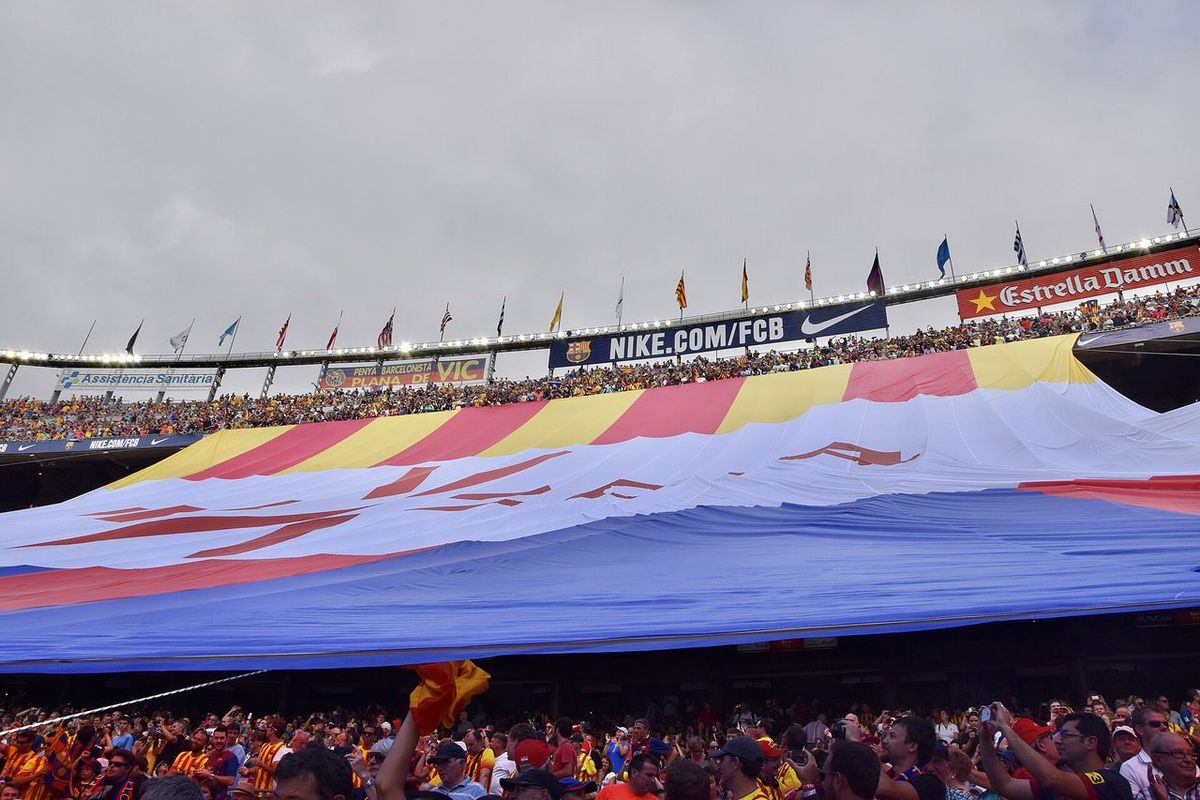Barça fans unfurl a giant tifo in the Camp Nou stands during a La Liga match